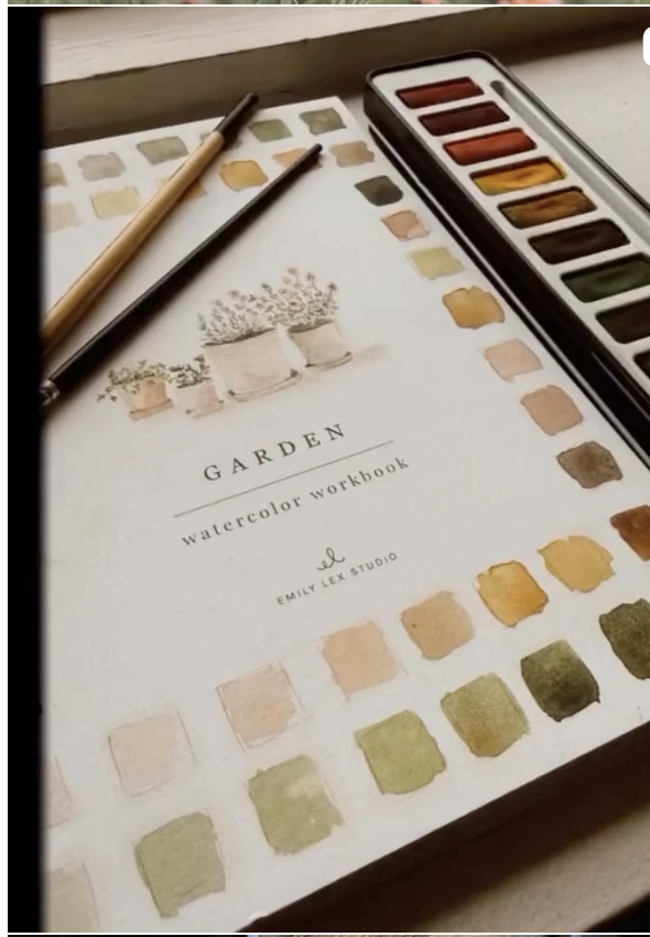 Guest creating a watercolor painting while slowing down at Natural Alternatives Salon and Spa Knoxville